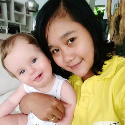 photo of Nanny Desy with infant